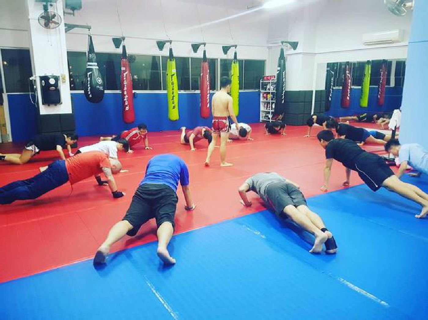 Muay Thai Singapore West students doing push-ups