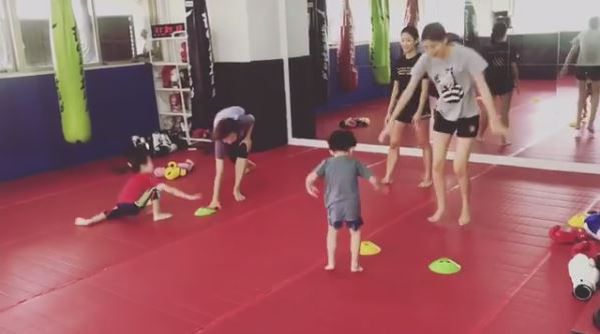 Muay Thai Singapore West kids and their parents having fun playing games together