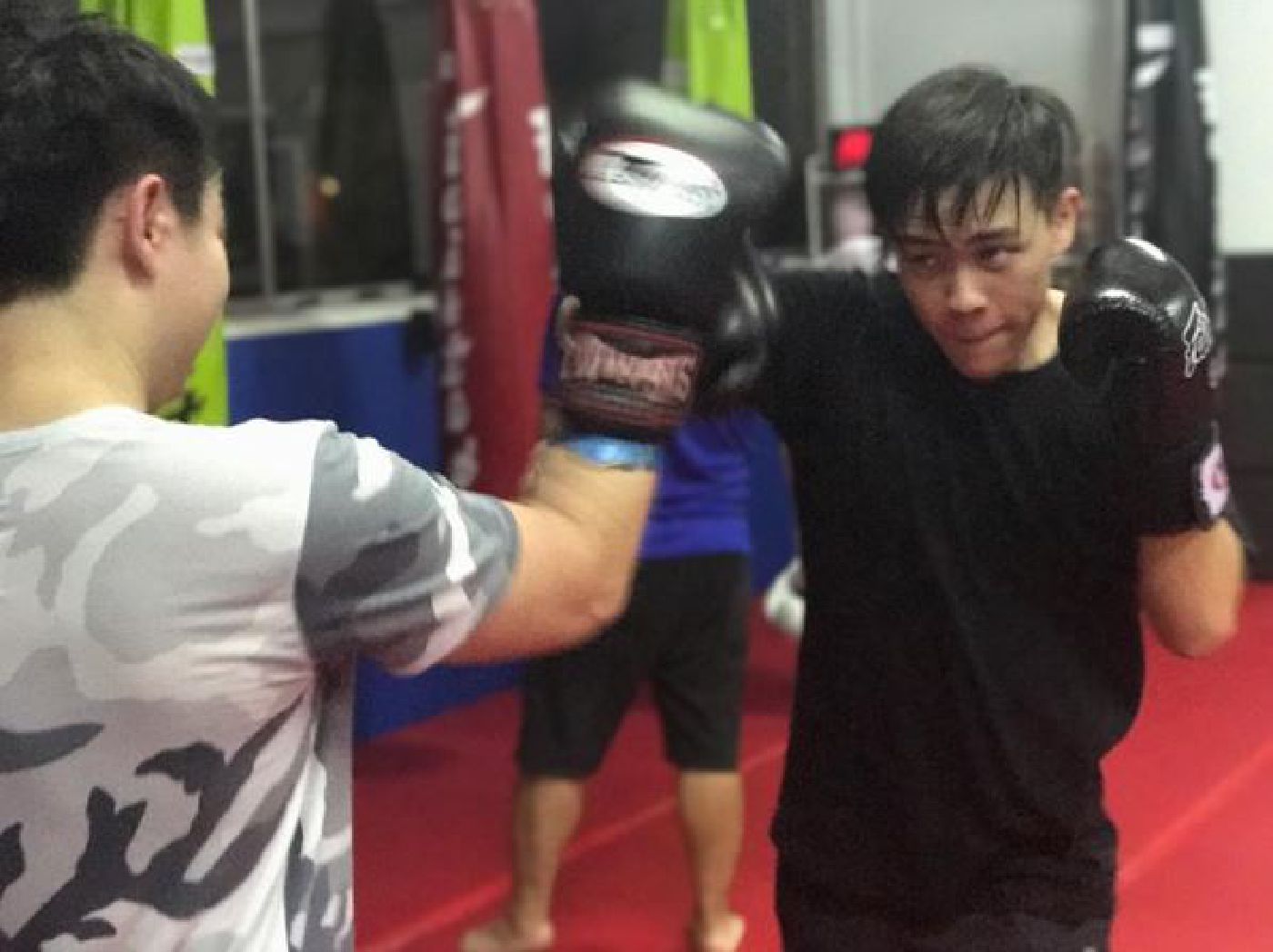 Muay Thai Singapore West students hard at work practicing their drills